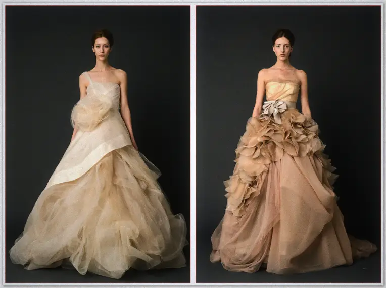Vera Wang Spring Collection 2012 3 Two models in champagne gowns with asymmetric ruffles and rosette detailing stand before dark grey