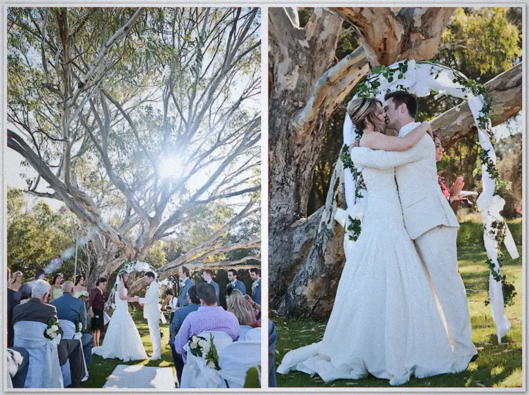 Lauren and Simon exchange vows under the gum tree, then kiss beneath an arch of white roses