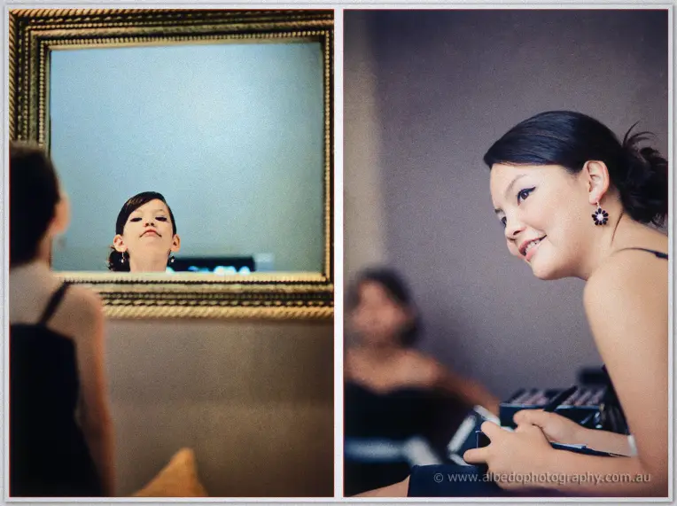 Fremantle Wedding | Charlene and Phil A bridesmaid checks her makeup in a gilded mirror while Charlene smiles at her dressing table