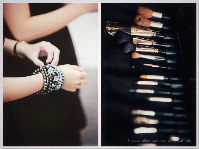 Fremantle Wedding | Charlene and Phil Hands clasp a beaded bracelet onto a wrist beside a row of well-used makeup brushes