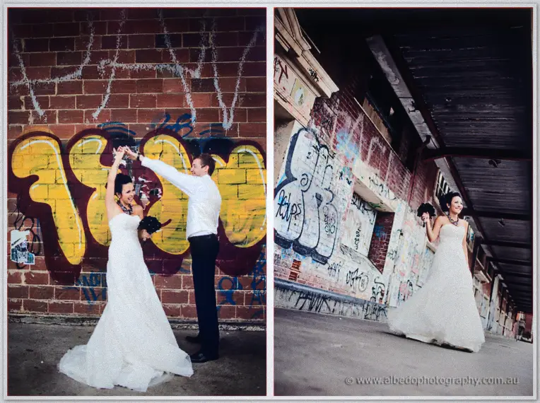 Fremantle Wedding | Charlene and Phil Phil twirls Charlene before a yellow-graffitied brick wall as she wanders a tagged underpass