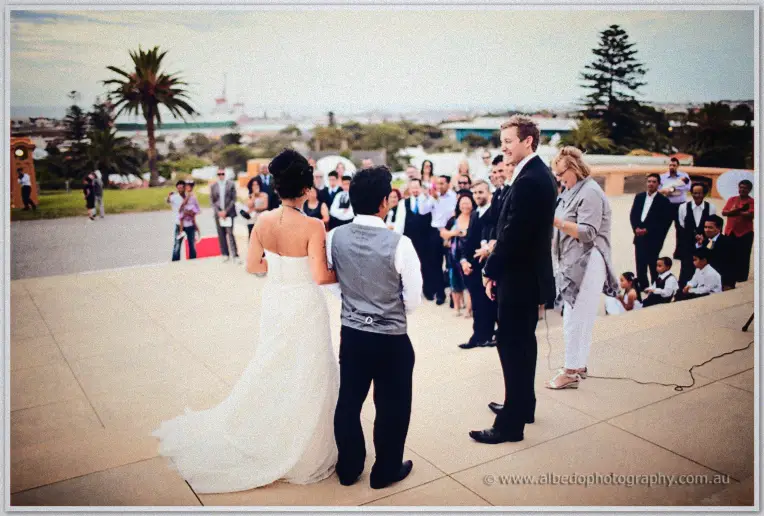 Fremantle Wedding | Charlene and Phil Charlene and Phil face their celebrant and guests on an esplanade terrace above Fremantle port