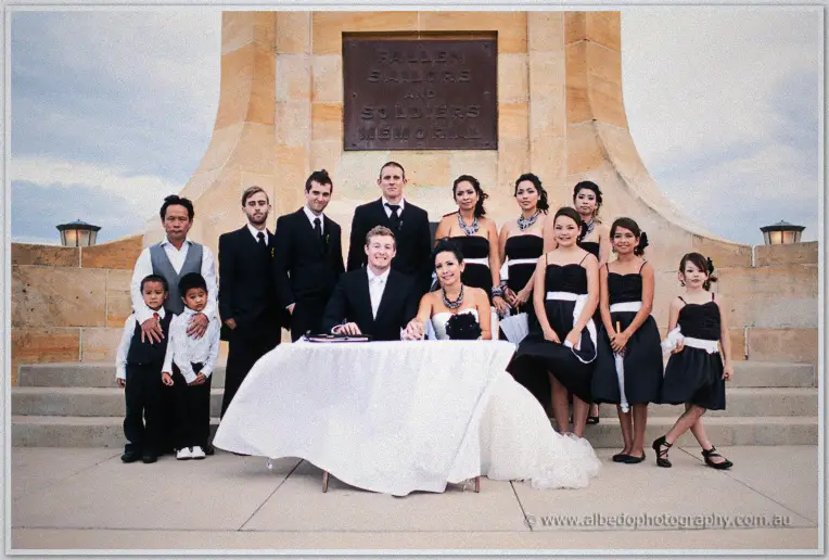 Fremantle Wedding | Charlene and Phil Charlene and Phil pose with their full wedding party around the signing table beneath the memorial