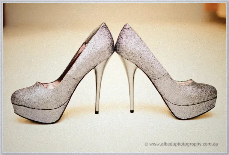 Fremantle Wedding | Charlene and Phil Charlene's silver glitter platform heels stand toe to toe on a pale floor before the Fremantle ceremony
