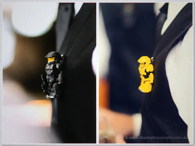 Fremantle Wedding | Charlene and Phil Black and yellow toy-figurine buttonholes pinned to the groomsmen's lapels in a playful close-up
