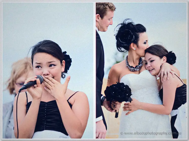Fremantle Wedding | Charlene and Phil A giggling junior bridesmaid covers the microphone before Charlene hugs her beside the memorial