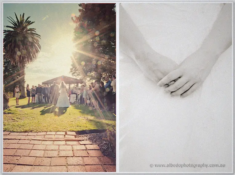 Sun flares over the lakeside ceremony as guests rise, beside a close view of hands clasped over Jenn's gown