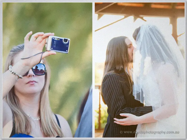 A guest shields her eyes to film the moment as Lance and Jenn share their first kiss under the gazebo