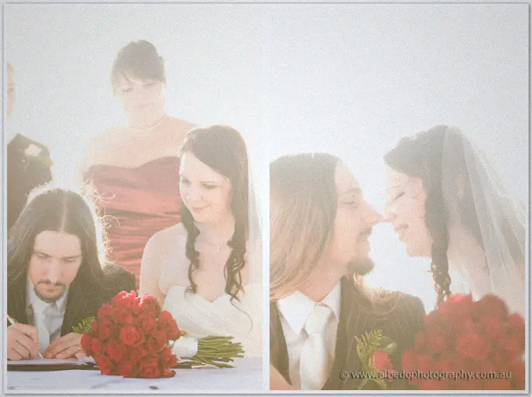 Lance signs the register beside Jenn and red roses, then the pair lean close, noses almost touching