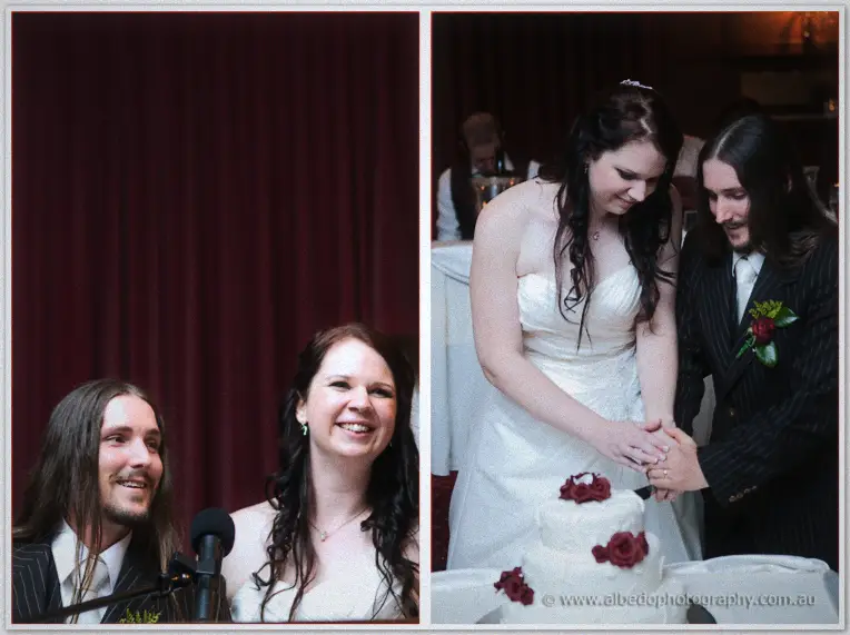 Jenn and Lance laugh at a microphone before cutting their rose-topped tiered wedding cake hand in hand