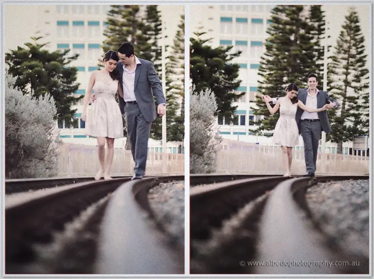 Pre wedding Fremantle | Jade and Aaron Jade and Aaron stroll barefoot along curved rail tracks past pines, hand in hand on the rails