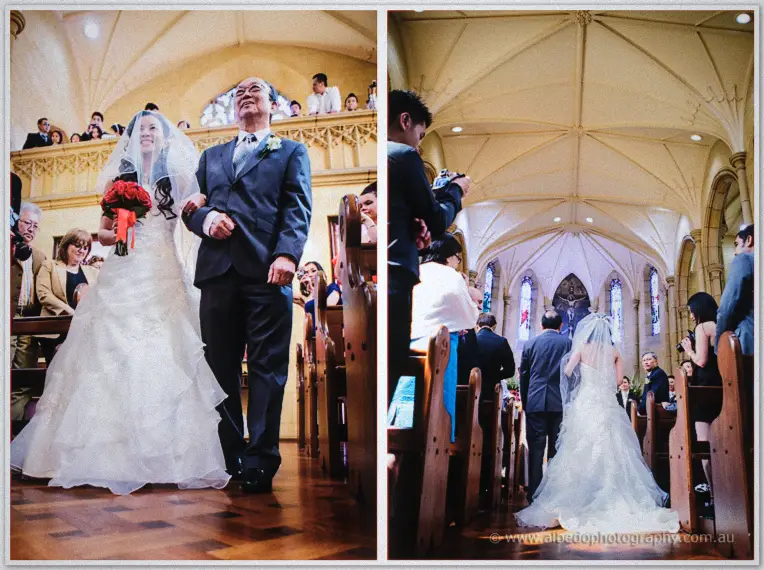Michelle walks the aisle on her father's arm, beaming past guests, then kneels with him before the altar.