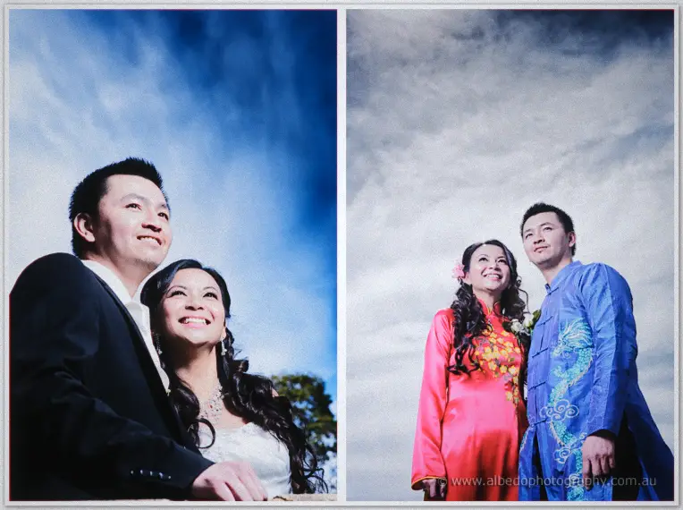Michelle rests her head on Khoa's shoulder, both laughing under a clear blue sky.
