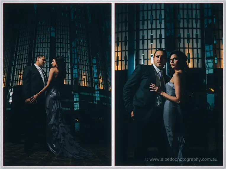 Dwarfed by glowing lattice walls, Lydia and Mina hold hands, then stare down the lens