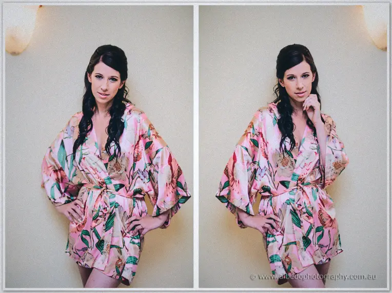 Sarah poses in a pink floral silk robe, hand on hip, in the soft light of her Brookleigh prep room.
