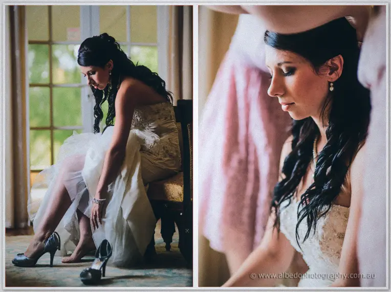 Seated by a garden window, Sarah bends to slip her foot into a satin peep-toe heel.