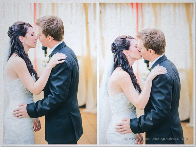 Diptych of the newlyweds leaning in for their first kiss between ribbon-hung canopy drapes.