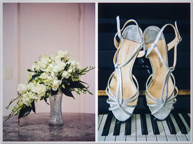 Sarah's cascading white orchid bouquet beside her glittering silver heels resting on piano keys