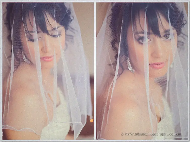 Sarah's soft gaze framed through the folds of her tulle veil, pearl earrings glowing in muted light