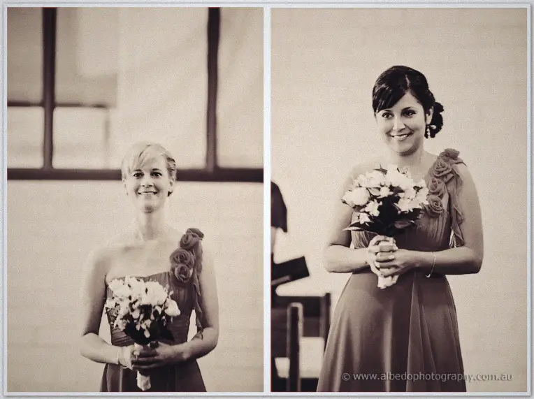 Sepia frames of the two bridesmaids walking the aisle with white bouquets in orange dresses
