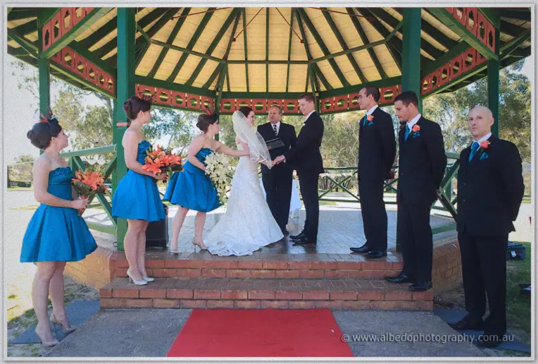 Full bridal party gathered inside the rotunda as vows begin on the red carpet