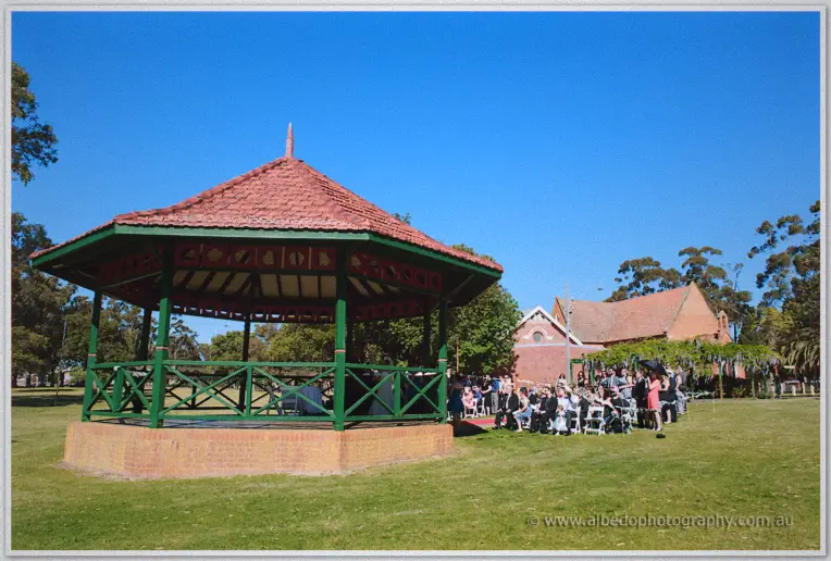 Wide view of Stirling Square's rotunda and gathered guests under a clear blue sky