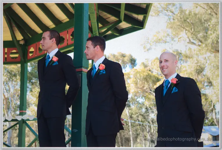 Groomsmen lined up beneath the rotunda roof during the ceremony