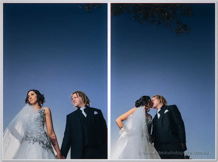 Jenna and Andrew stand hand in hand beneath the dusk sky, then lean in for a kiss