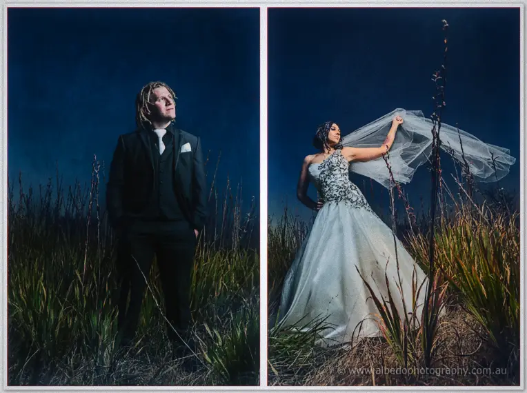 Twilight portraits of Andrew in dark suit and Jenna lifting her veil in tall grass at dusk.