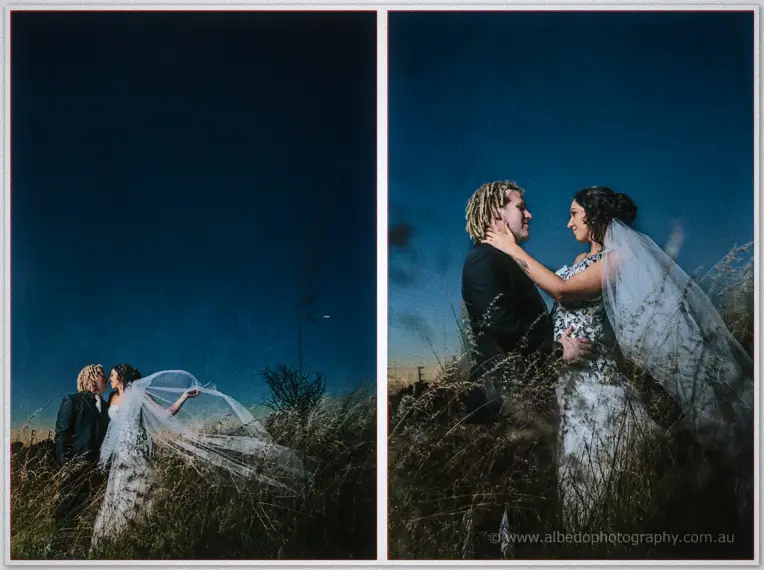 Dusk frames of Jenna and Andrew in the grassland, her long veil streaming in the wind.