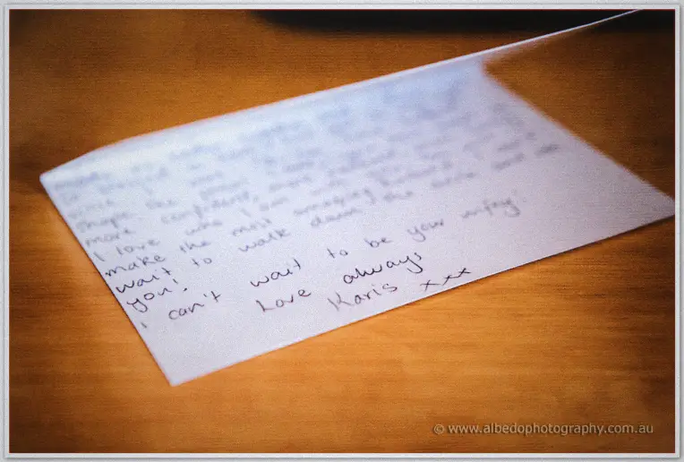 Karis's handwritten note to Nathan awaits him on a timber table