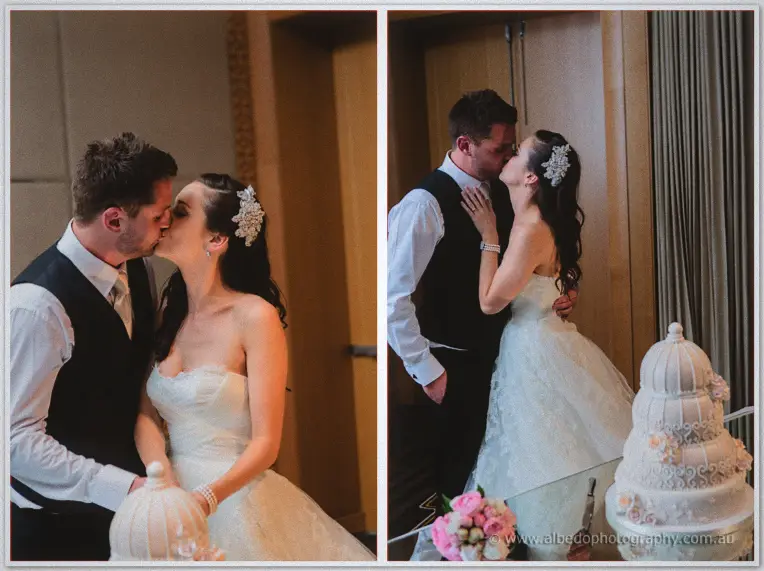 Two frames of Karis and Nathan kissing over their pale pink birdcage wedding cake