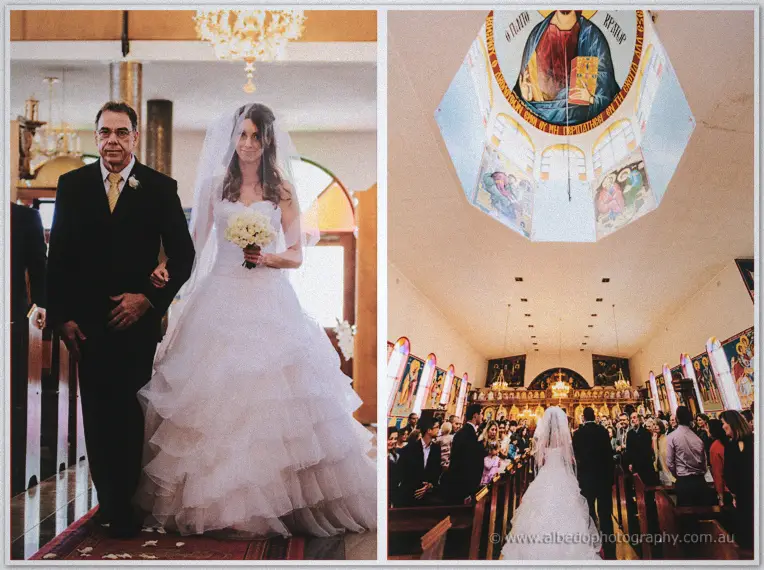 Bride on her father's arm approaching the altar beneath a domed ceiling of painted icons
