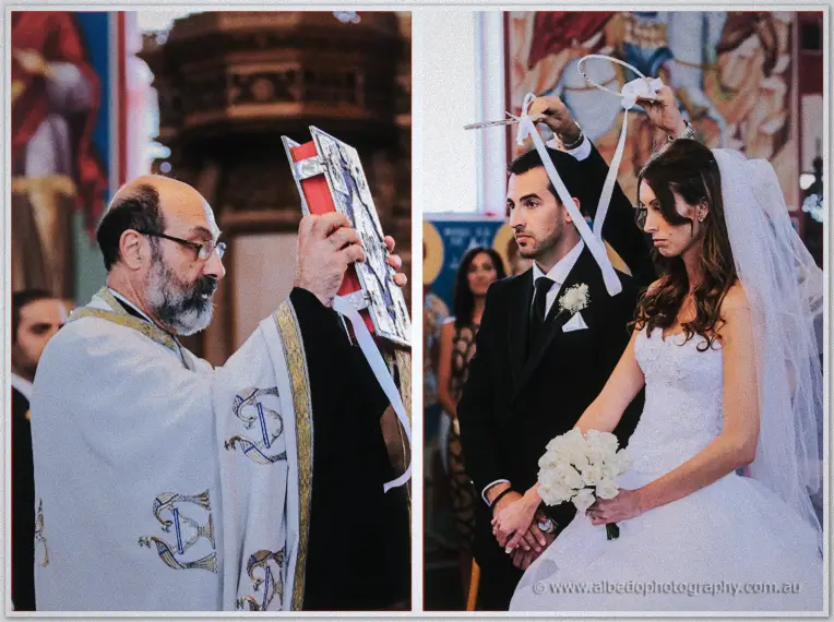 Priest raising the gospels before crowning the couple beneath the church's painted icons