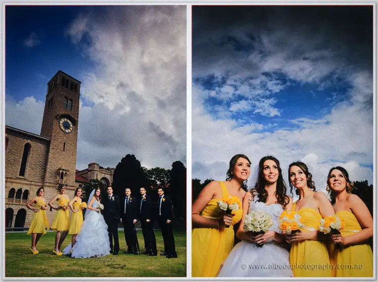 Nick and his groomsmen stand beneath the stormy sky by the university clock tower in black suits.