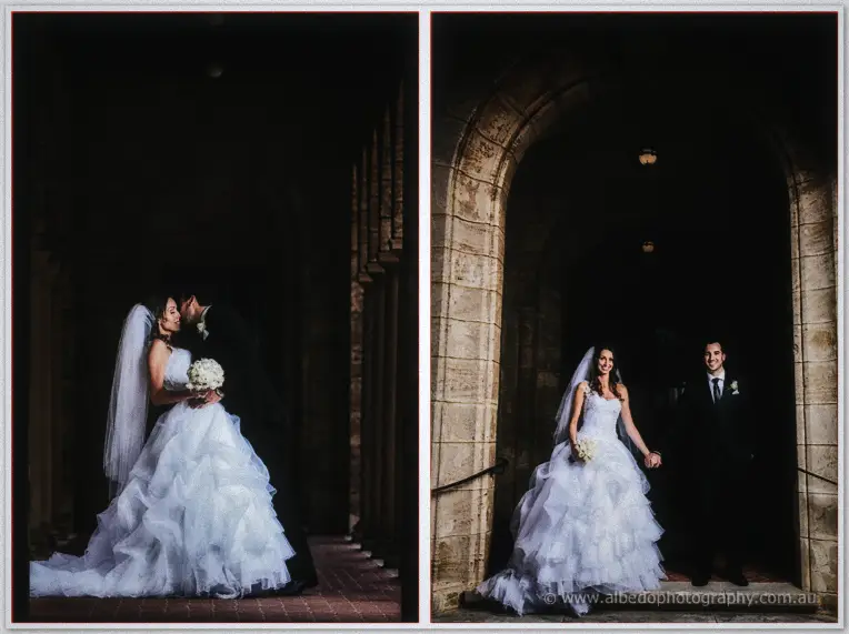 Michele and Nick steal a kiss and a smile in the dark stone arches of the university quadrangle.
