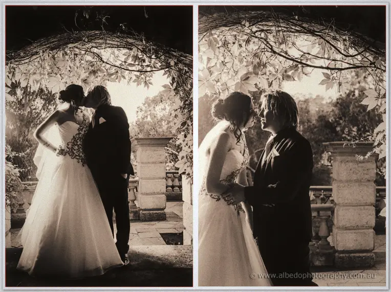 Two sepia frames of Jenna and Andrew kissing and laughing beneath a leafy vine archway.