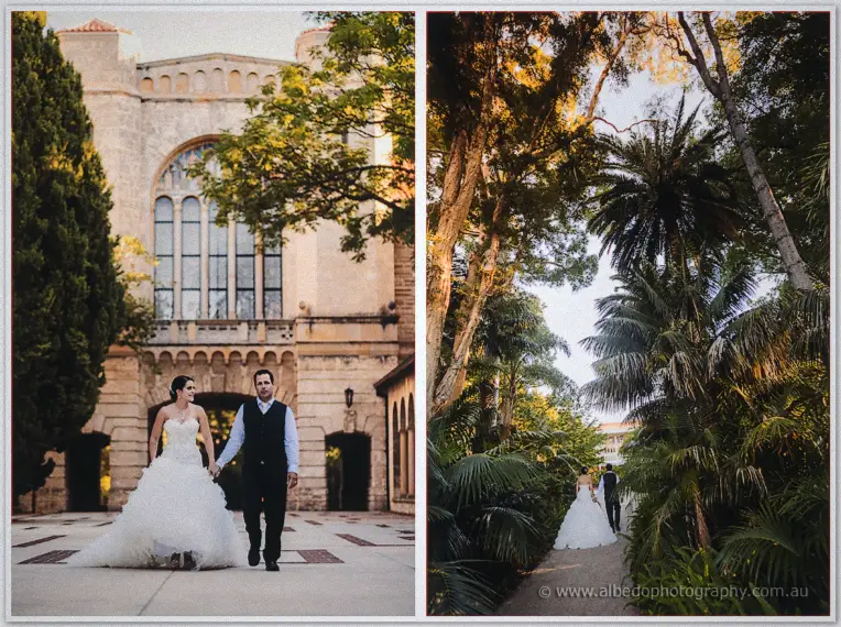 The pair stroll from the cathedral's tall arched window away beneath a canopy of sunlit trees.