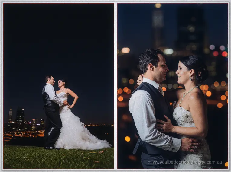 Allison and Greg dance on a dark hilltop lawn, Perth's city lights glowing as soft orange bokeh behind them.