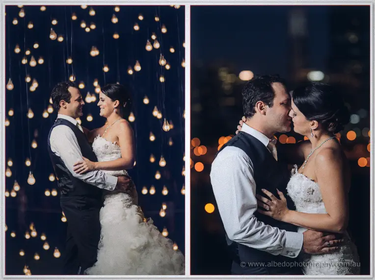 The couple nose to nose under cascading fairy lights, then a soft kiss against blurred city lights at night.