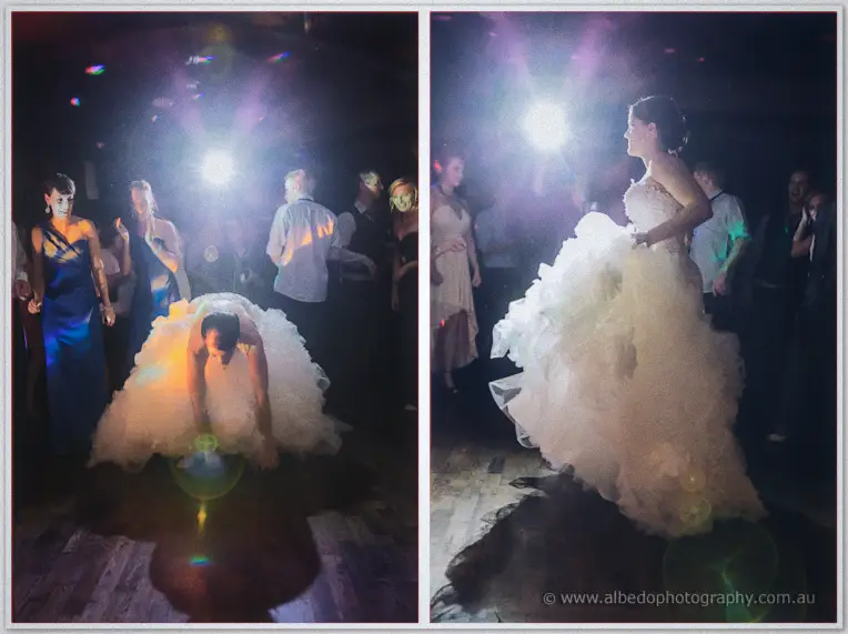 Allison diving into the tulle mountain to fish out a garter, then spinning with it billowing around her.