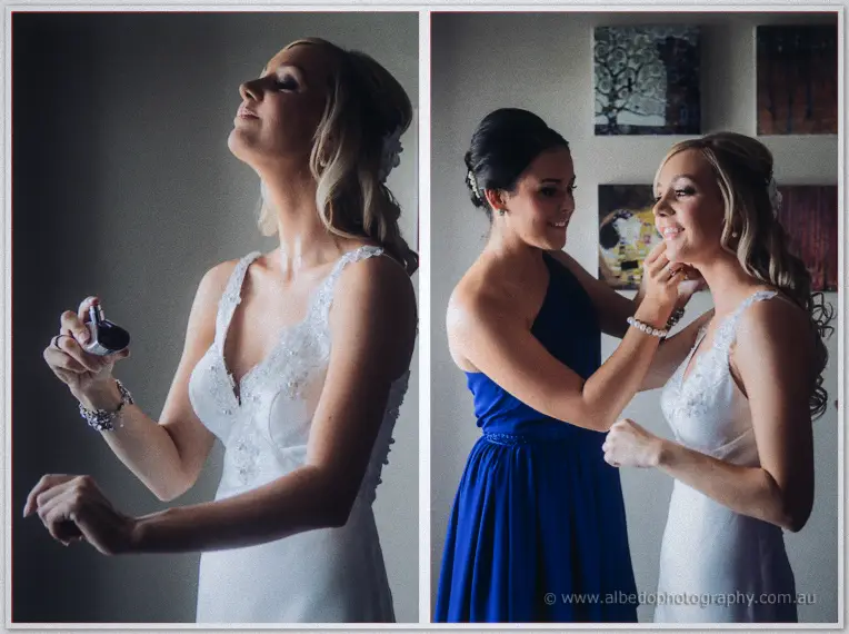Kristyn spritzes perfume in her lace gown while a bridesmaid clips on her pearl bracelet.