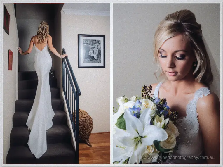 Kristyn descends a carpeted staircase in her backless gown, then gazes down at her white lily bouquet.
