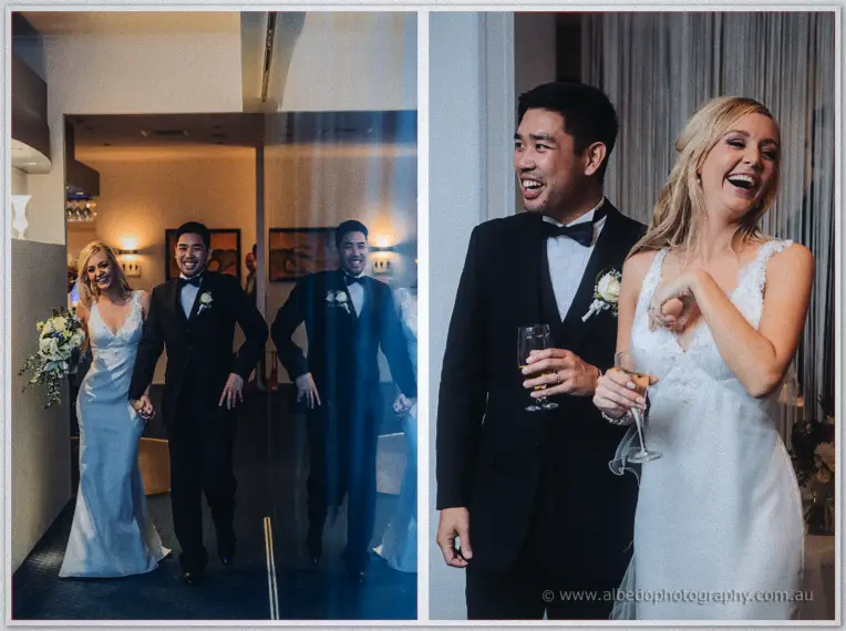 Kristyn and Chris make their entrance hand in hand, then laugh together with champagne in hand