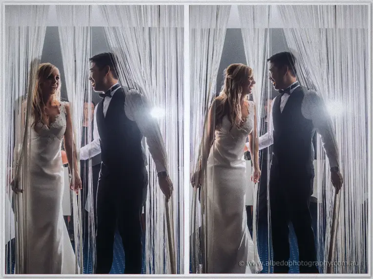 Dancing cheek to cheek behind falling strands of white curtain, the couple sway bathed in backlight