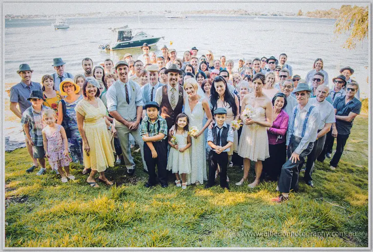 Tansy and Ciaran gather their wedding guests on the riverside lawn at Green Place Reserve, Mosman Park
