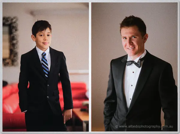Page boy in a striped tie stands beside the smiling groom in a two-frame portrait by a red couch