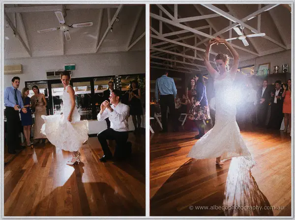 The groom kneeling and the bride twirling in a two-panel set on the timber dance floor.