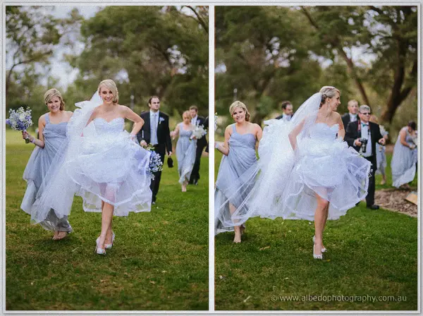 Sarah lifts her ruffled skirt and dashes across the wet grass with a laughing bridesmaid in tow