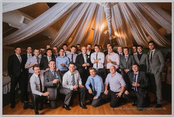 Nathan's mates crowd into a big group photo beneath the fairy-lit draped ceiling at Joondalup